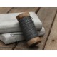 Jute ribbon on wooden spool coal